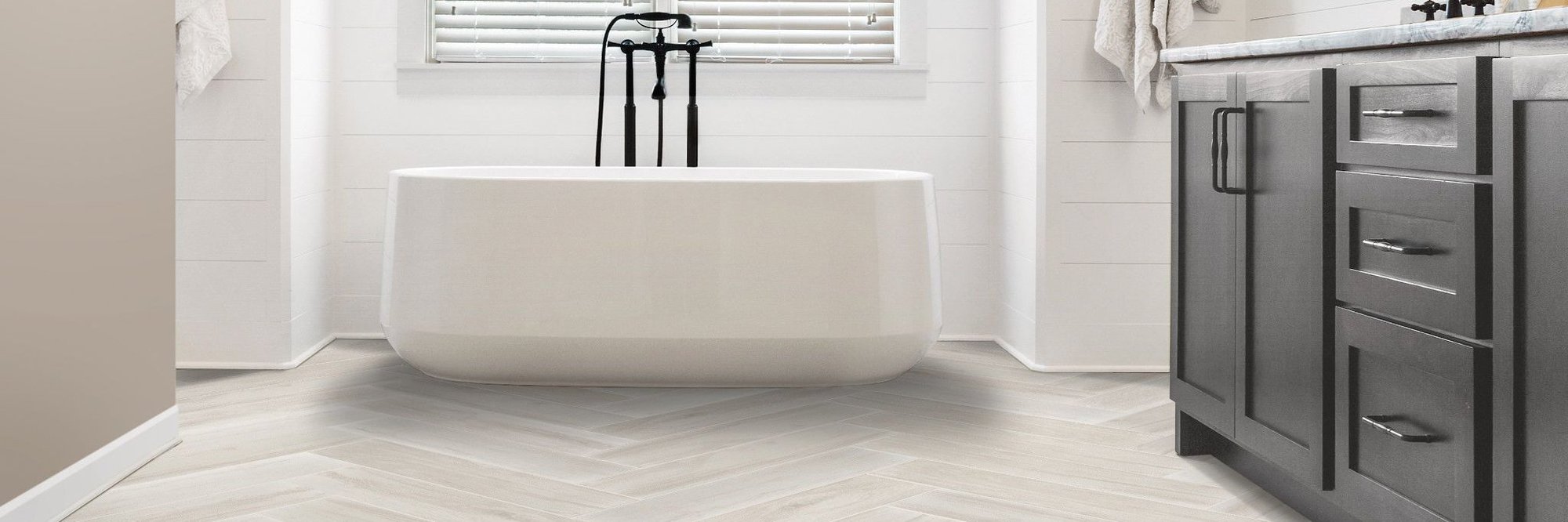 Bathroom with a white bathtub Laydwel Floors in Appleton, WI