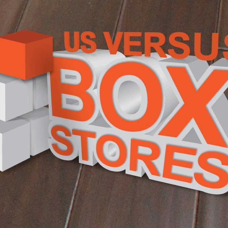 Us-Vs-The-Box-Stores-Logo-Laydwel Floors in Appleton, WI